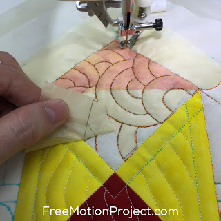 Learn how to mark a quilt block with paper in a tutorial with Leah Day